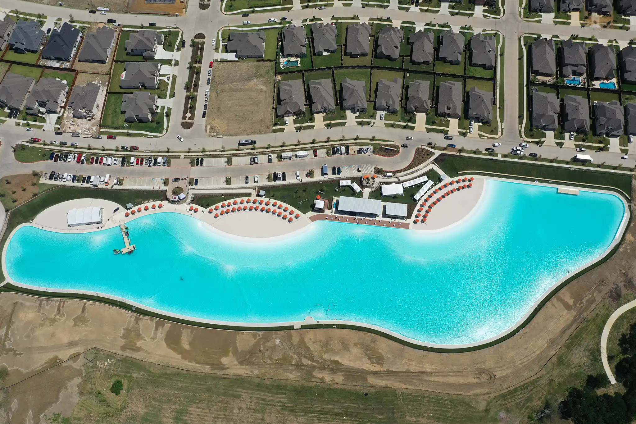 An aerial view of a lagoon and beaches at Windsong Ranch.