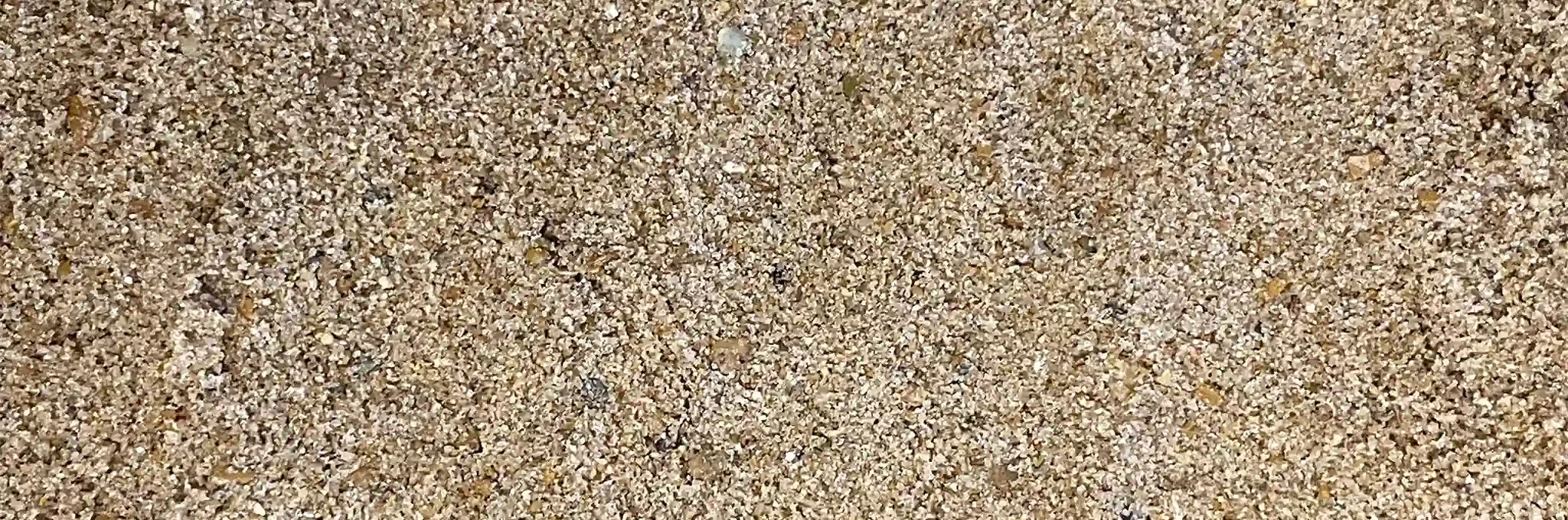 A close-up view of Greens Construction Sand, Tee Sand, and Drainage Sand.
