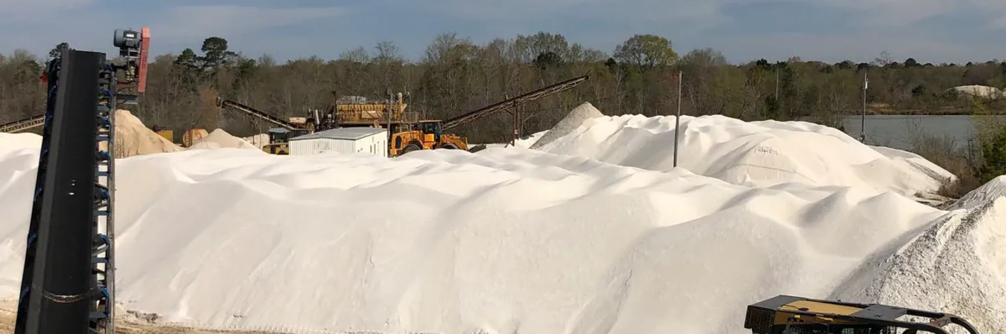 Piles of Premier White sand.