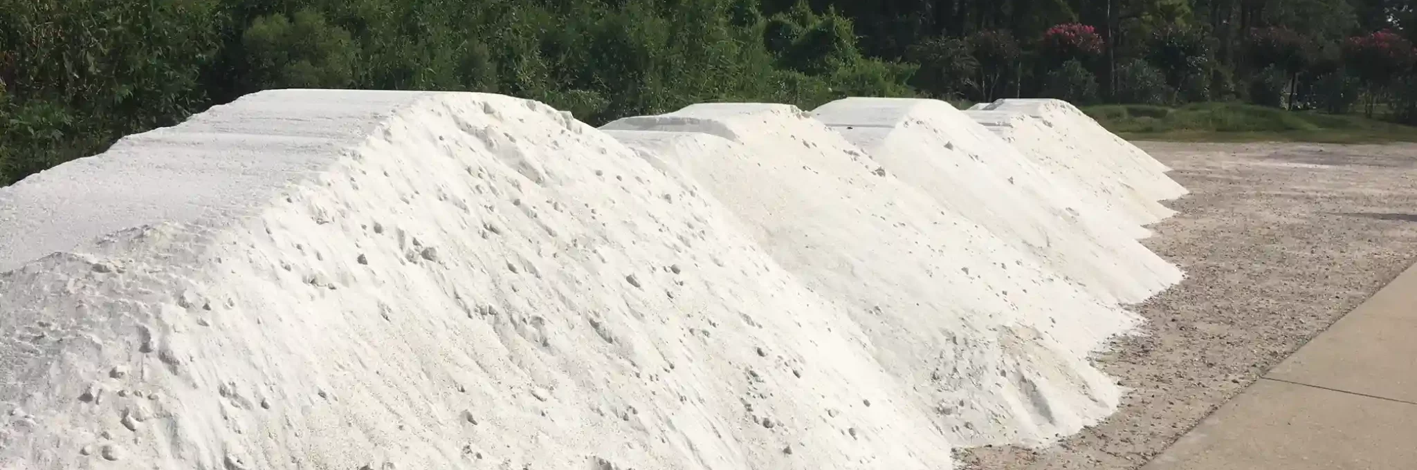 Piles of Premier White sand.